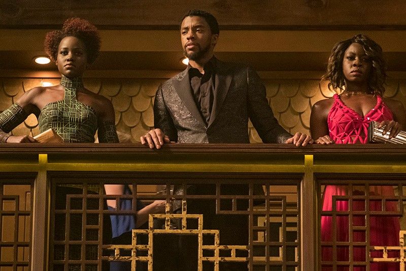 Nakai (in green), T'Challa (in black), and Okoye (in red) at the South Korean casino in the Black Panther movie.